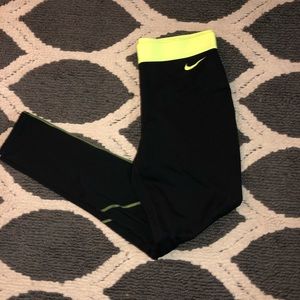 Black nike pro dri-fit leggings with yellow accent